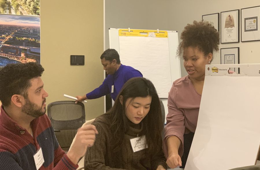 Darby helping two people with assignment