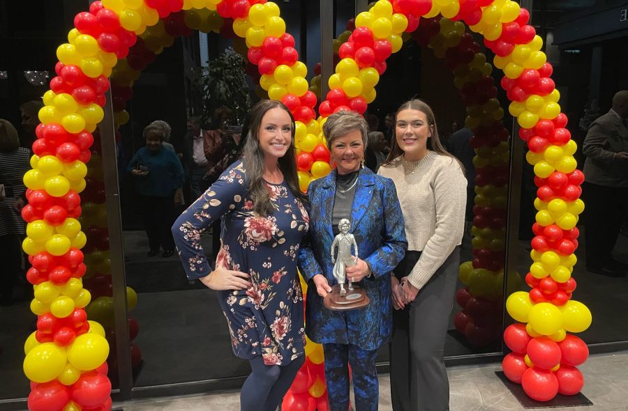 Amy with McDonalds Owner/Operator receiving a reward