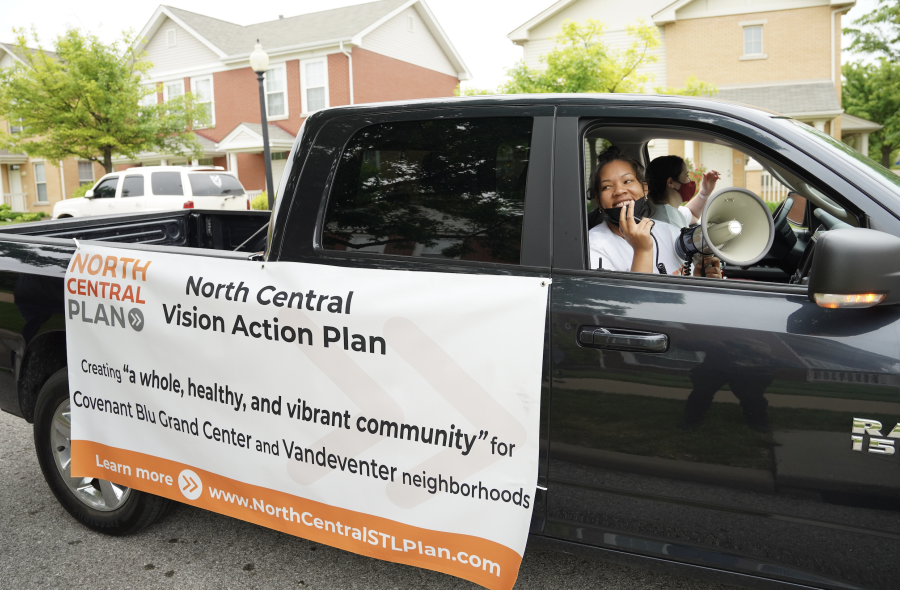 Darby with bullhorn in pickup truck