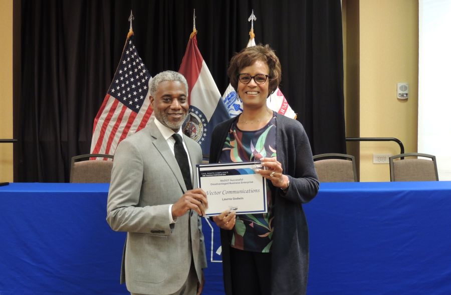 Laurna with MoDOT employee and award